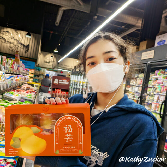 Young girl standing in Korean grocery store holding ice cream